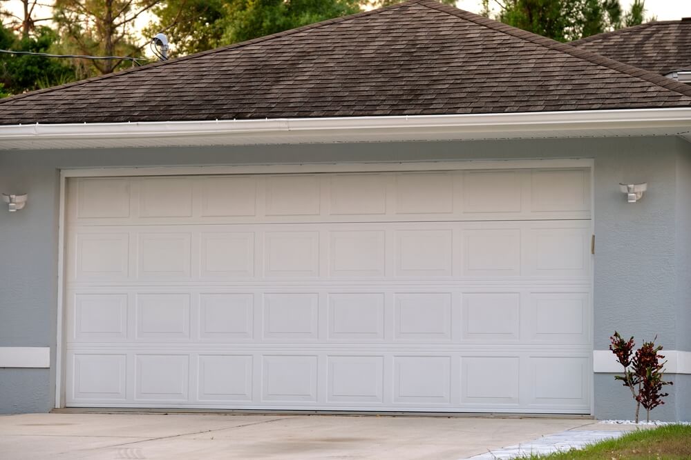 Technician operating an indoor garage door